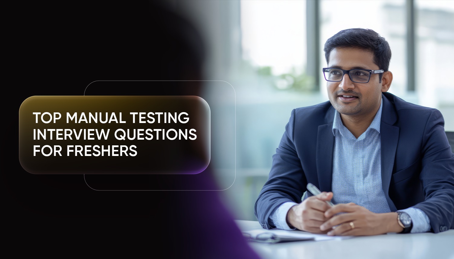 A professional interviewer sitting at a desk during a discussion, representing a manual testing interview scenario for freshers preparing for software testing roles.