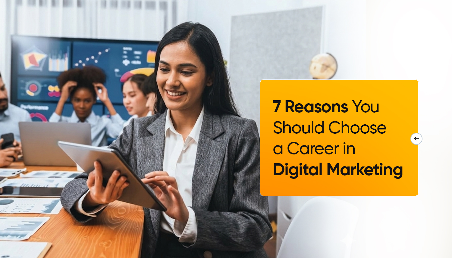 young professional working on tablet with team analyzing data in office, representing career opportunities in digital marketing and modern marketing workspace