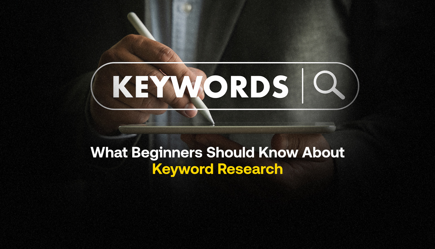 Hands conducting keyword research on a tablet for beginners learning SEO and digital marketing
